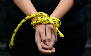 Des militants d'Amnesty International lors d'une manifestation contre la torture le 4 septembre 2014 à Mexico
