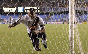 Brazilian footballer Romario, of Vasco da Gama team, stretches out to head the ball to score against Botafogo the one thousandth goal of his career 11 April, 2007 at the Maracana stadium in Rio de Janeiro, Brazil. Romario failed again and keeps trying.