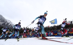 Emilien Jacquelin of France, center, Johannes Thingnes Boe of Norway, right, and Quentin Fillon Maillet of France, 2nd left, compete during the men's 15 km mass start competition at the Biathlon World Championships in Antholz, Italy, Sunday, Feb. 23, 2020.