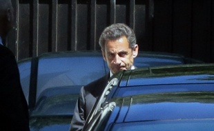 Nicolas Sarkozy le 2 juillet 2014 devant son domicile de Paris.