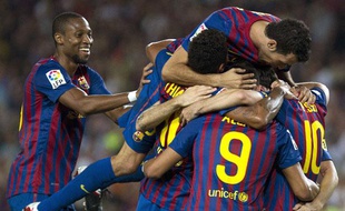 Les joueurs du FC Barcelone célèbrent un but contre Villareal, le 29 août 2011, au Camp Nou.