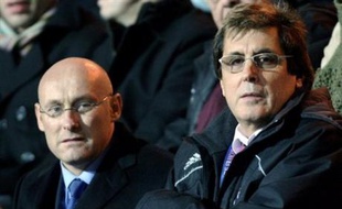 French Junior Minister for Sports Bernard Laporte (L) attends with Paris' president Max Guazzini the French Top 14 rugby union match Stade Francais Paris vs Bayonne, 23 November 2007 at the Jean Bouin stadium in Paris. AFP PHOTO / THOMAS COEX