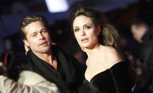 U.S. actors Angelina Jolie, right, and Brad Pitt arrive at the European premier of the movie "The Tourist" in Berlin on Tuesday, Dec. 14, 2010. (AP Photo/Markus Schreiber)/Germany_Film_Premier_The_Tourist_MSC109/1012142008