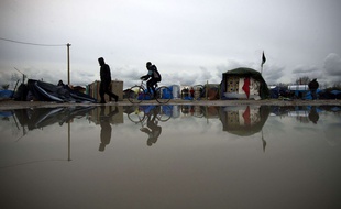Des migrants dans la