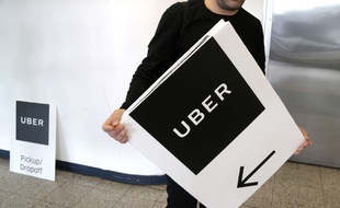 Un panneau Uber à l'aéroport La Guardia à New York.