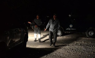 Des forces de sécurité afghanes sur les lieux d'un attentat à Kaboul, le 29 novembre 2014