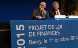 French Finance Minister Michel Sapin(L) and French Junior Budget Minister Christian Eckert presented the draft Finance Bill 2015.