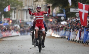 Denmark's Mads Pedersen celebrates winning the men elite race, at the road cycling World Championships in Harrogate, England, Sunday, Sept. 29, 2019.