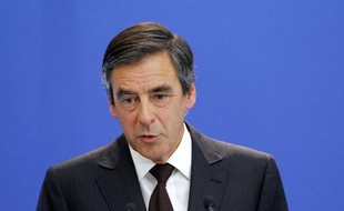 France's Prime Minister Francois Fillon speaks on August 24, 2011 in Paris during a press conference to unveil measures to achieve billions of euros in fiscal savings. Fillon announced a mix of spending cuts and tax hikes to save roughly 14 billion euros ($20 billion) over two years. AFP PHOTO / PATRICK KOVARIK