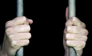 Une personne en prison. (Illustration)