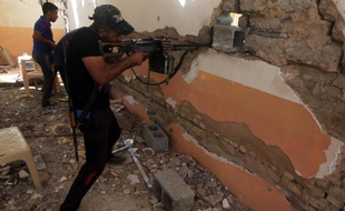 Des forces irakiennes combattent le 17 septembre 2014 à Dhoulouiyah