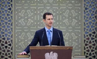 Photo fournie par l'agence de presse officielle syrienne montrant le président Bachar al-Assad lors de la cérémonie d'investiture pour son nouveau mandat, le 16 juillet 2014 à Damas