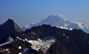 A picture taken on July 22, 2015 in Tignes, southeastern France, shows the Italian side (Northern side) of the Mont Blanc, the highest mountain in the Alps. AFP PHOTO / LOIC VENANCE