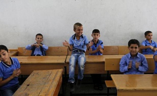 Jour de rentrée des classes pour de jeunes Palestiniens dans une école des Nations Unies à Gaza City le 14 septembre 2014
