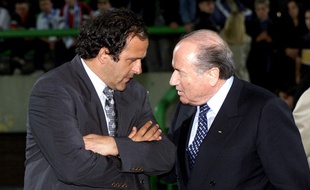 TIONAL SQUAD IN SARAJEVO.MICHEL PLATINI CHATS TO PRESIDENT OF FIFA STEPP BLATTER BEFORE THE FRIENDLY MATCH.