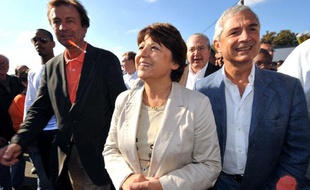La première secrétaire du Parti socialiste Martine Aubry arrive accompagnée de (GàD) de Francis Parny (PCF), Jean-Paul Huchon (PS) et de Claude Bartolone, le 13 septembre 2009 à La Courneuve près de Paris, lors de la Fête de l'Humanité.