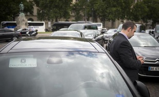 Un conducteur de voiture de tourisme avec chauffeur (VTC) à la manifestation du 21 juillet 2014