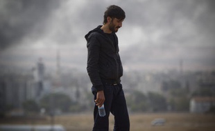 Daesh continue sa progression dans la ville de Kobané, et se rapproche de la frontière turque, le 10 octobre 2014.