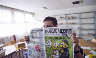 Le dessinateur Charb et un des dessins parus en septembre 2012
