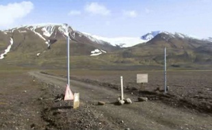 FILE - This is a Aug. 19, 2014 file image taken from video of a sign is posted on the road next to Bardarbunga, a subglacial stratovolcano located under Iceland's largest glacier. Earthquakes are rocking Iceland's Bardarbunga volcano, adding to concerns that magma movements may trigger an eruption that could hinder air traffic. Iceland's Met Office says two earthquakes measuring over magnitude 5 shook the volcano under the vast Vatnajokull glacier on Wednesday Aug. 27 2014. Some 500 quakes have hit the area since midnight. (AP Photo/Courtesy Channel 2 Iceland, File) ICELAND OUT/LON805/390295547613/IMAGE FROM VIDEO. AP PROVIDES ACCESS TO THIS PUBLICLY DISTRIBUTED HANDOUT PHOTO PROVIDED BY CHANNEL 2 ICELAND FOR EDITORIAL PURPOSES ONLY. ICELAND OUT./1408271458
