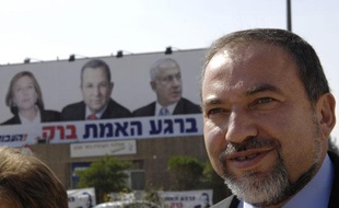 Avigdor Lieberman, leader of hardline right-wing party Yisrael Beitenu, walks down the street during a tour of the southern Israeli town of Beer Sheva February 7, 2009. REUTERS/Amir Cohen (ISRAEL)
